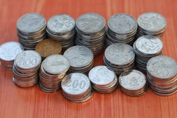 a stack of rupiah coins, indonesian currency