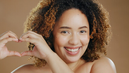 Portrait of happy woman, heart hands or natural beauty dermatology for wellness in studio with...