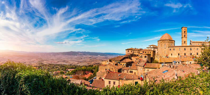 Fototapeta Tuscany, Volterra town skyline, church and panorama view. Maremma, Italy, Europe. Panoramic view of Volterra, medieval Tuscan town with old houses, towers and churches, Volterra, Tuscany, Italy.