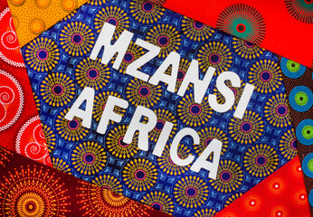 Mzansi, a slang word for South Africa, in white letters with iconic South African Shwe Shwe fabric