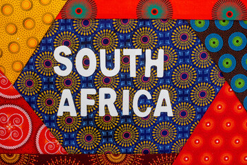  South Africa, in white letters with iconic South African Shwe Shwe fabric