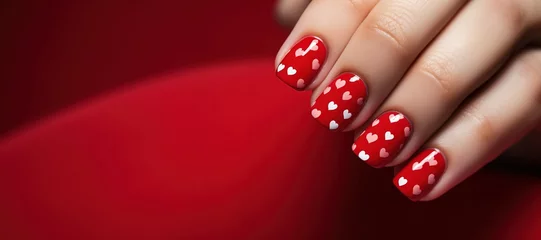 Papier Peint photo ManIcure banner Valentines day nail art, Female hands with beautiful fashion glamour manicure in red colors with hearts design on nails on red background. copyspace