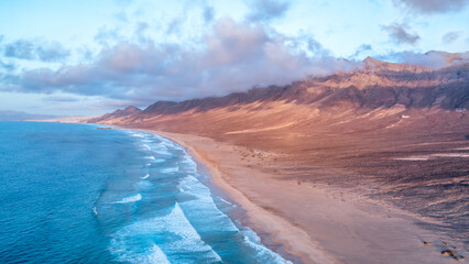Drone shot during sunset at the beach of Playa de Cofete on the island Fuerteventura in Spain