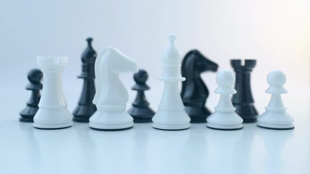 Black and white chess pieces on a white background. Chess game. Queen. King. Rook. Knight. Bishop. Pawn.