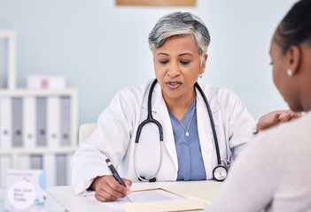 Senior doctor, patient and writing consultation for prescription, diagnosis or checkup at hospital. Mature female person, medical or healthcare surgeon filling paperwork or life insurance at clinic