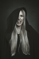 Beautiful black hooded vampire woman. Halloween book cover - 657162152