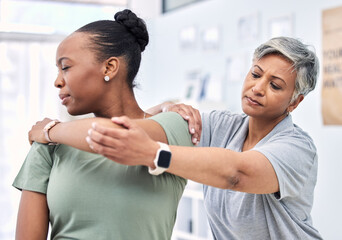 Shoulder pain, physical therapy and chiropractor with patient, injury and healthcare with help and women at clinic. Physiotherapy, stretching muscle and anatomy with body, support and trust in health - obrazy, fototapety, plakaty