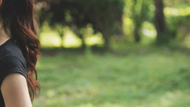 A Young Woman Runner Runs At Sunset In A Park In The Park.