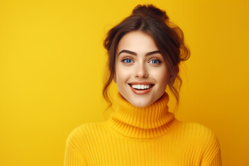 Portrait of a happy woman in a yellow background