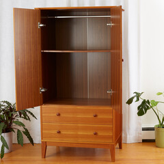 Vintage Teak Armoire. Mid-Century Modern Furniture. Interior scene with large houseplants and luxurious white curtain. 