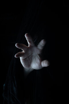 Human hand on dark background, halloween hand on dark background