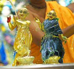 Abhishek of lord krishna and radha during Radhashtami festival celebration