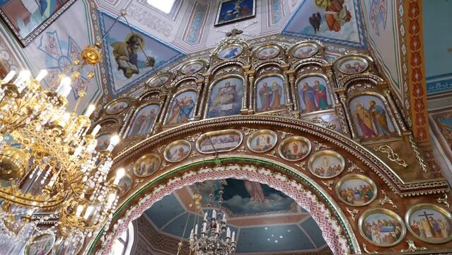 Interior, architecture of the Orthodox church with painting, iconostasis and panikadylo.
