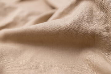 Natural linen fabric texture. Rough crumpled burlap background. Selective focus