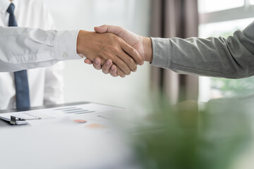 Businessman shaking hands successful making a deal. mans handshake. Business partnership meeting concept