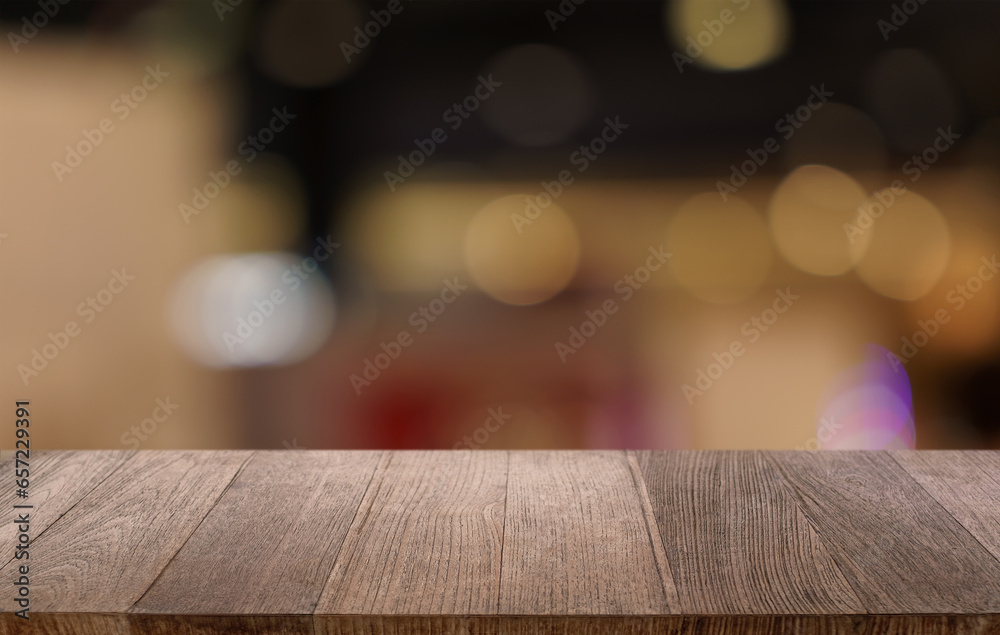 Sticker Mock up for space. Empty dark wooden table in front of abstract blurred bokeh background of restaurant . can be used for display or montage your product