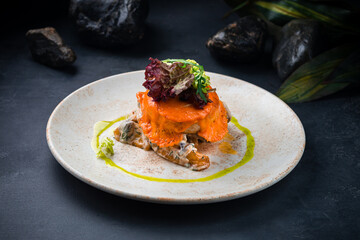 Dinner pork cutlet with potatoes, mushrooms, cheese, salad and sauce.