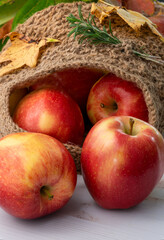 Red apples in a white handmade cross stich basket.