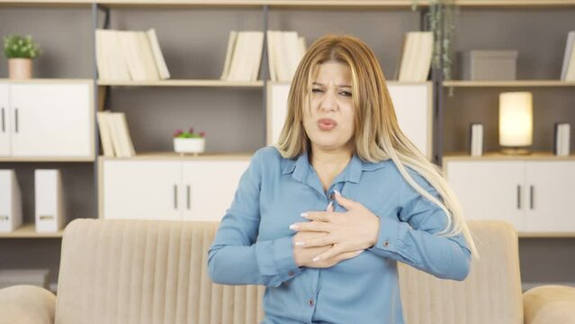 Woman having heart attack.
