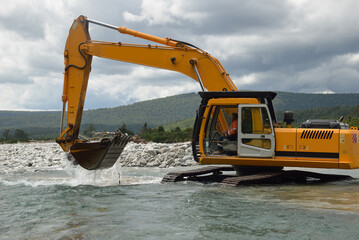 digger in the river