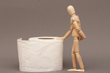 A scene, a concept from a mannequin and toilet paper showing constipation, diarrhea.