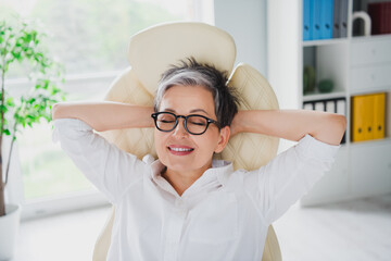 Portrait of attractive mature age businesswoman hands head sleep after colleagues meeting comfort isolated on light room office background