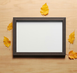 Black thin picture frame with fallen leaves