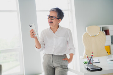 Photo of happy cheerful lady professional wear white shirt communicating instagram twitter telegram...