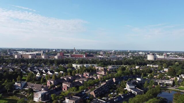 Aerial shot of the modern city of Zwolle during daylight on a sunny day. 4k video