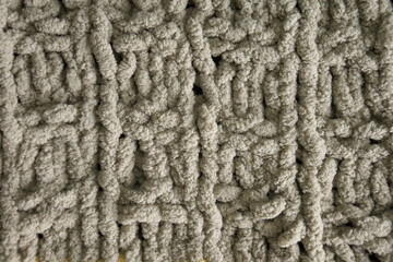 Dark brown handmade knitting blanket background.
