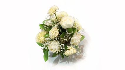 A bouquet of white roses is used for table decoration