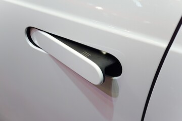 close up of modern car door handle without keyhole or keyless