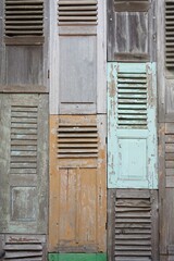 The walls of the unique house are made of old wooden windows