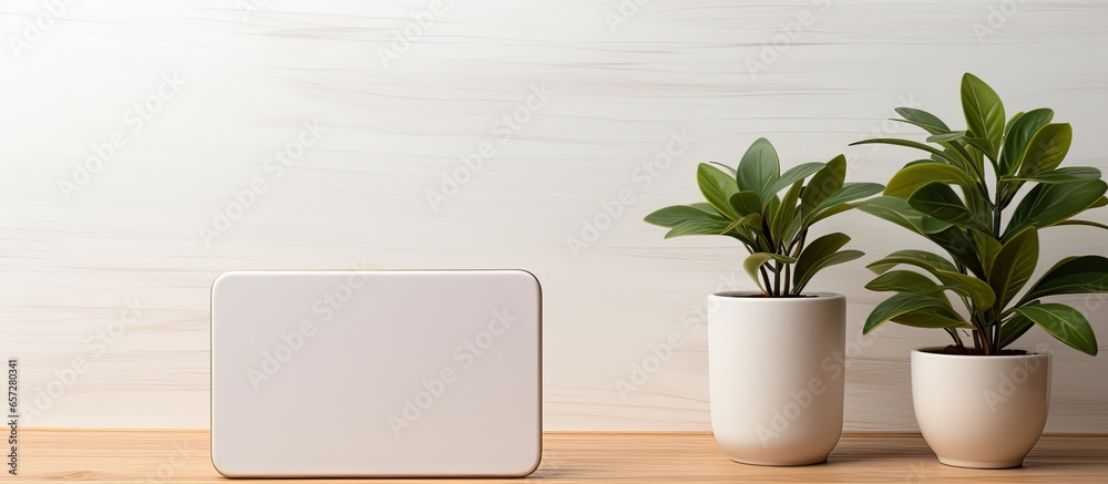 Poster Simplified workspace with digital tablet plant phone on white table Room to display products