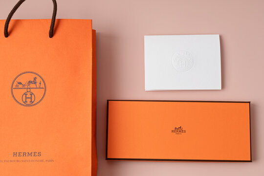 Lyon, France - October 04, 2023: orange hermes boxes. Luxury gift for holidays, mothers day, birthday, saint valentine day, christmas