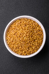 Raw bulgur wheat porridge as an ingredient for preparing a delicious dish