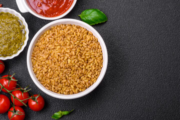 Raw bulgur wheat porridge as an ingredient for preparing a delicious dish