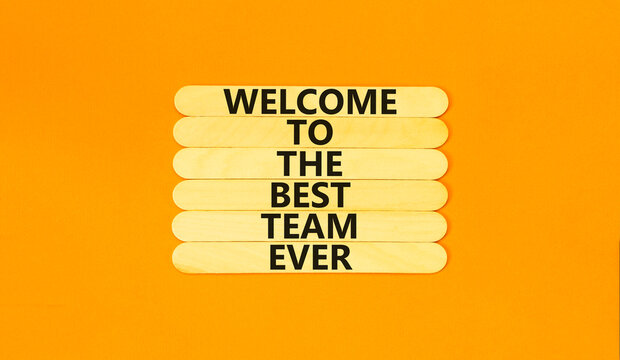 Welcome to best team symbol. Concept words Welcome to the best team ever on wooden stick on beautiful orange background. Business, motivational and welcome to best team concept.