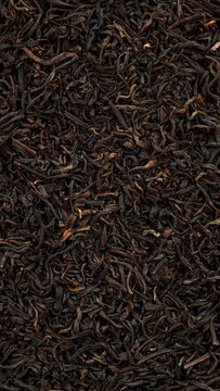 Top view of unpressed pu-erh tea background texture. Table spin. Seamless loop. Vertical video. 