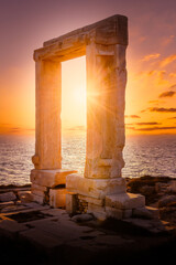 Portara at sunset, ruins of Apollo temple on Naxos island, Cyclades archipelago, Greece