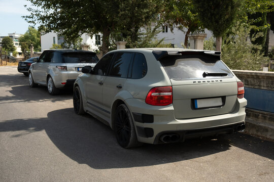 Antalya, Turkey - 10 October, 2023: A modified Porsche Cayenne from rear view in a street under the sunlight