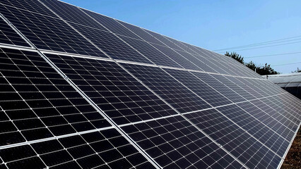 Closeup of surface of blue photovoltaic solar panels mounted on building roof for producing clean...