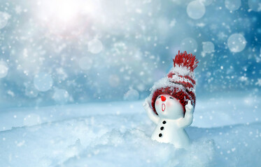 One little snowmen in caps on snow in the winter. Background with a funny snowman. Christmas card. - 657310948