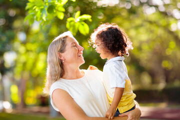 Mother and son in sunny park.