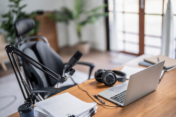 Digital technology equipment with laptop and microphone for recording audio podcast in home studio