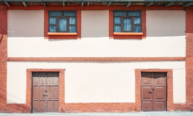 Fototapeta na wymiar Street view of the facade of an old colonial building, architecture background, Ecuador.