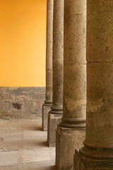 Set of classic concrete columns, interior building perspective, pillars detail with yellow...