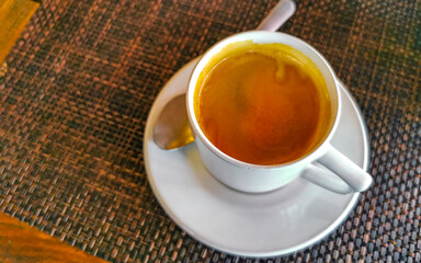 Cup of americano black coffee in restaurant cafe in Mexico.
