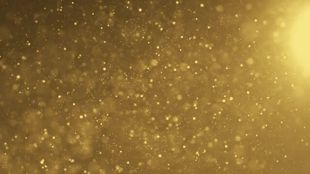 Gold ink in water shooting with high speed camera. Gold glitter background with sparkle shine light confetti. Super Slow Motion at 1000fps. effect. blue glitter