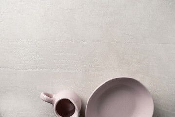 Pottery on a concrete light background, top view, homeware